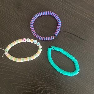 Three handmaid clay bead bracelets.